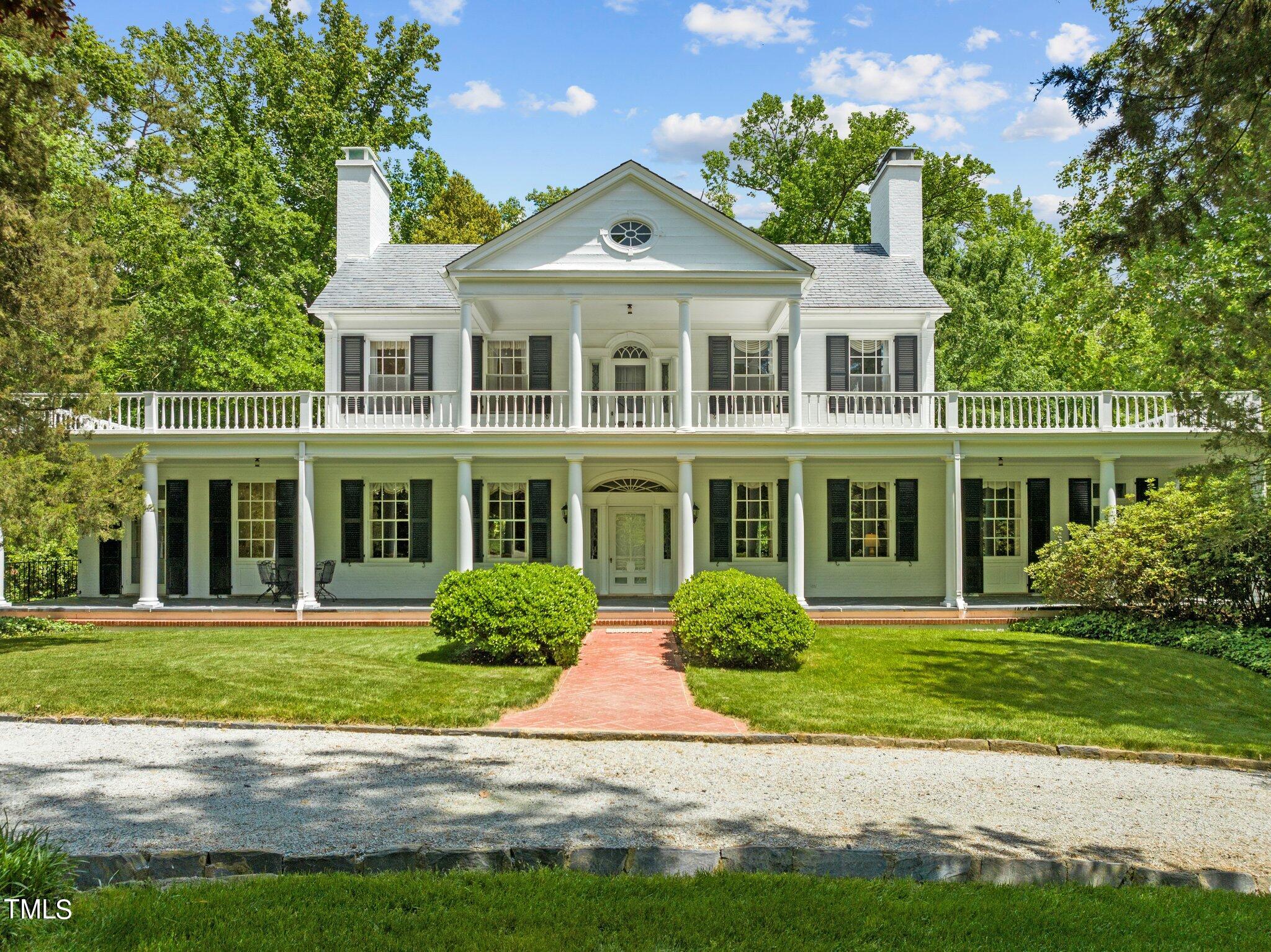 3116 Cornwall Road Durham, NC 27707 - Photo 69 of 85 a front view of a house with a yard and potted plants