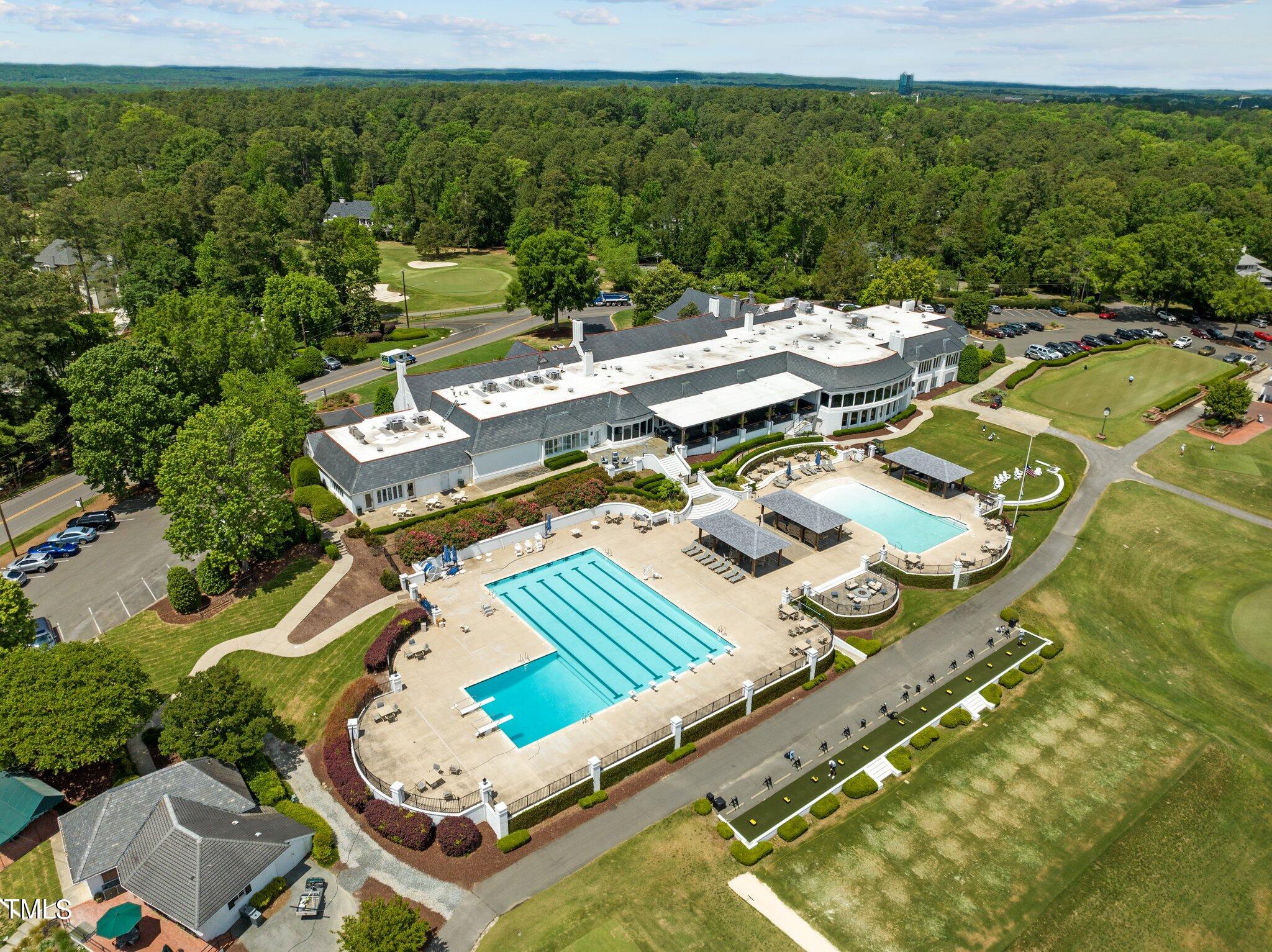3116 Cornwall Road Durham, NC 27707 - Photo 84 of 85 a picture of outdoor space with seating area and trees in the background