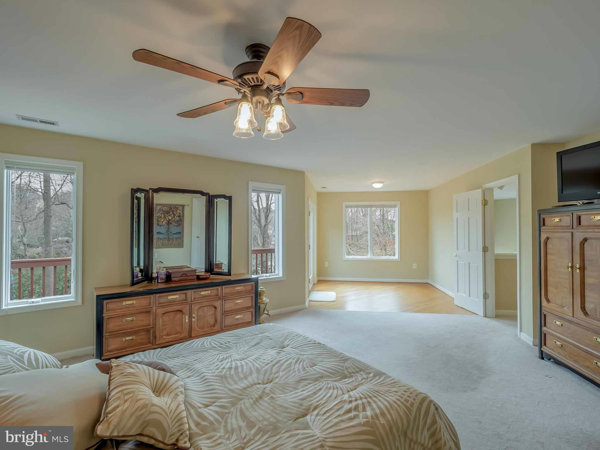 13110 Soundings Road Lusby, MD 20657 - Photo 21 of 30 a bedroom with a large bed and a large window