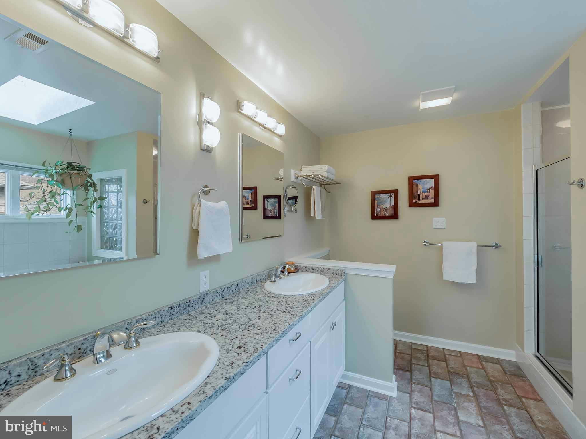 13110 Soundings Road Lusby, MD 20657 - Photo 24 of 30 a bathroom with a granite countertop sink and a mirror