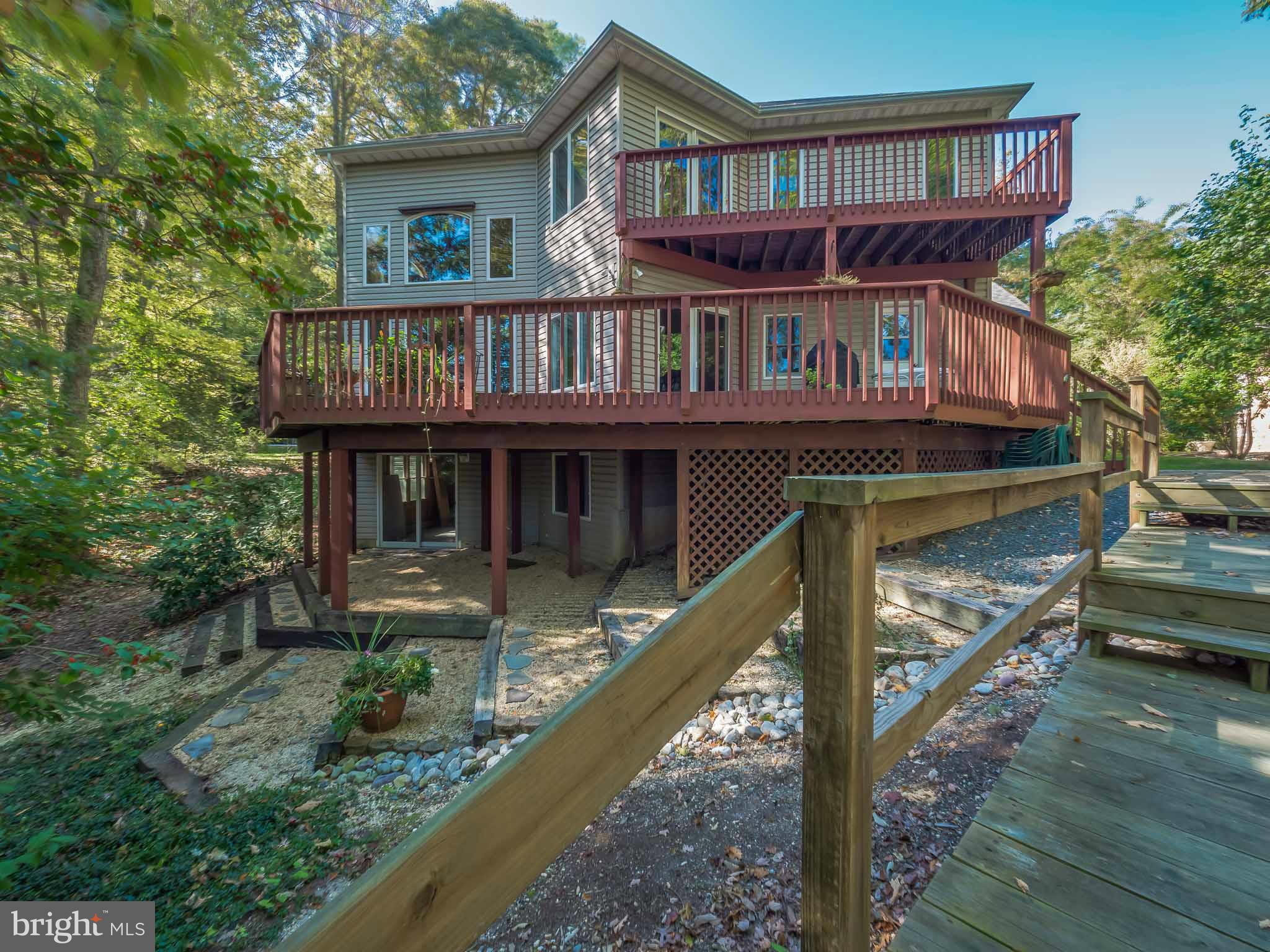 13110 Soundings Road Lusby, MD 20657 - Photo 28 of 30 a front view of a house with roof deck