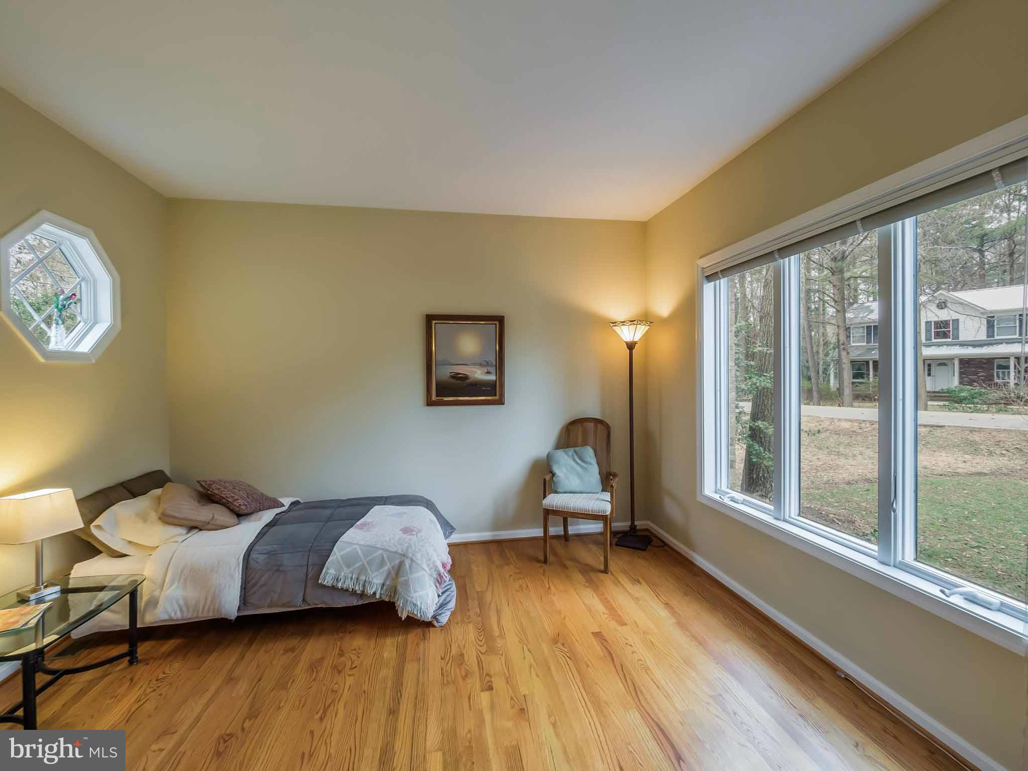 13110 Soundings Road Lusby, MD 20657 - Photo 5 of 30 a living room with a bed furniture and a large window