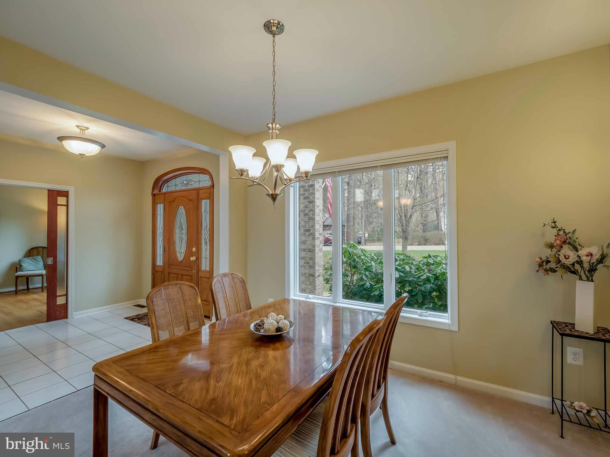 13110 Soundings Road Lusby, MD 20657 - Photo 6 of 30 a view of a dining room with furniture window and outside view