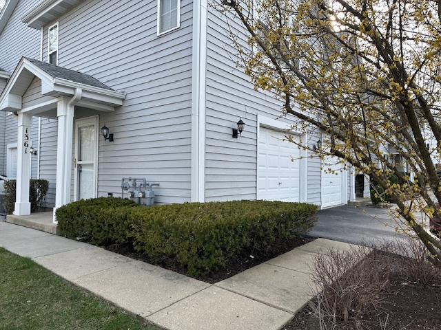 1361 Orleans Drive Mundelein, IL 60060 - Photo 1 of 13 a front view of a house with a yard