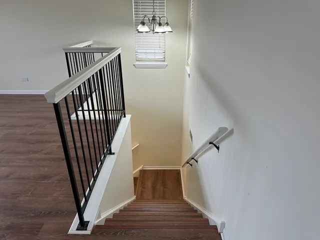 a view of entryway with wooden floor