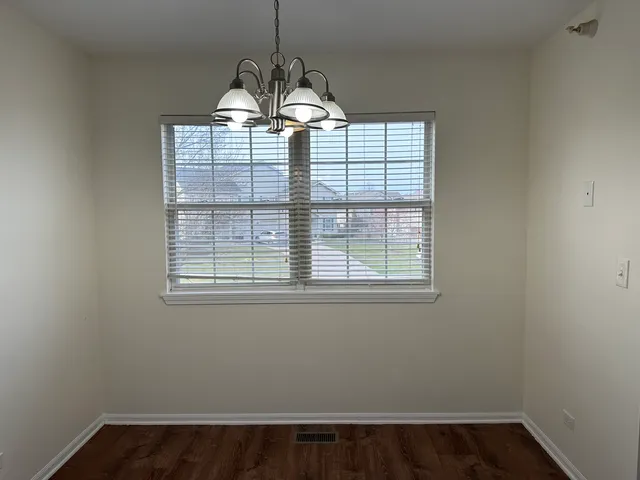 a view of a windows and chandelier in a room