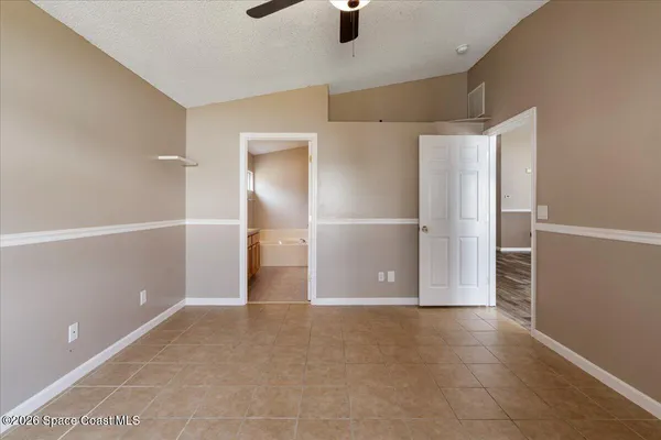 a room with wooden floor and natural light