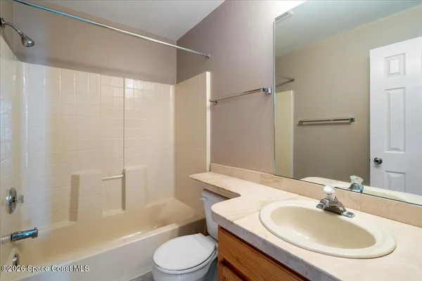 a view of a lake with chairs