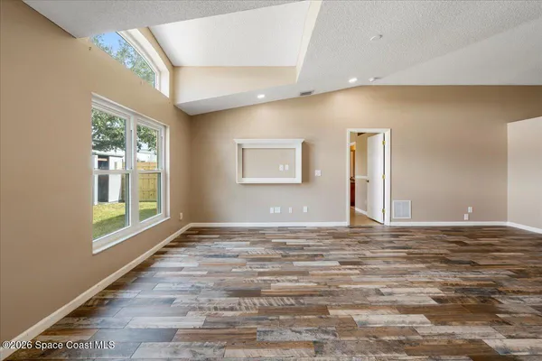 a kitchen with a refrigerator and a sink