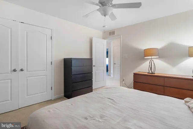 a bedroom with a bed and a dresser