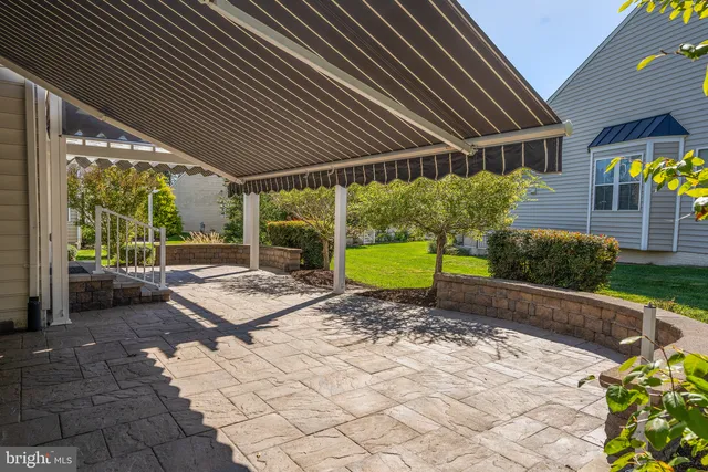 a view of a dining room with furniture and window