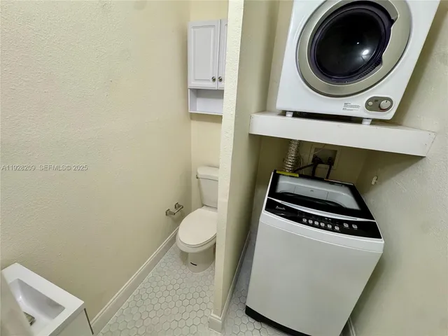 a utility room with dryer and washer