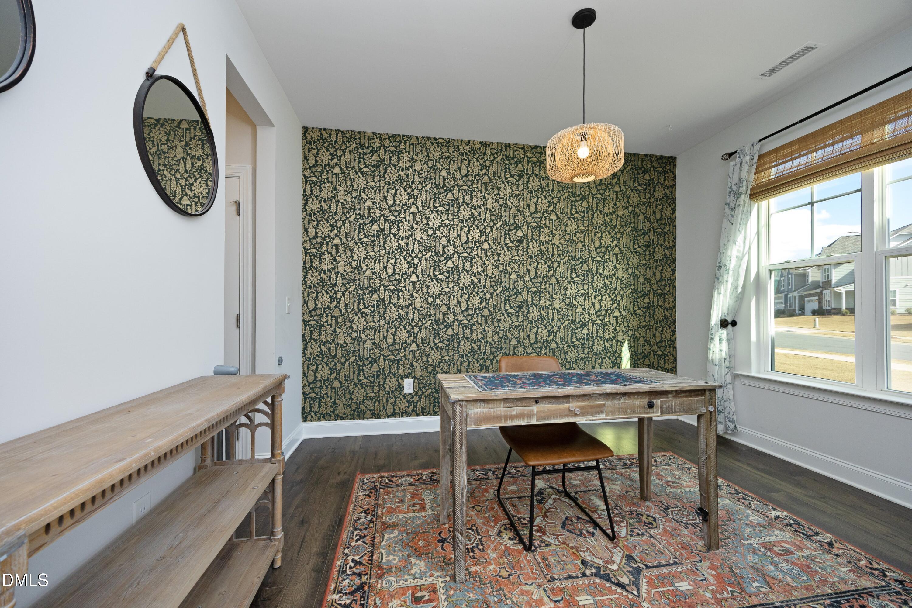 500 Ressler Street Holly Springs, NC 27540 - Photo 12 of 37 a view of a room with a table and chairs