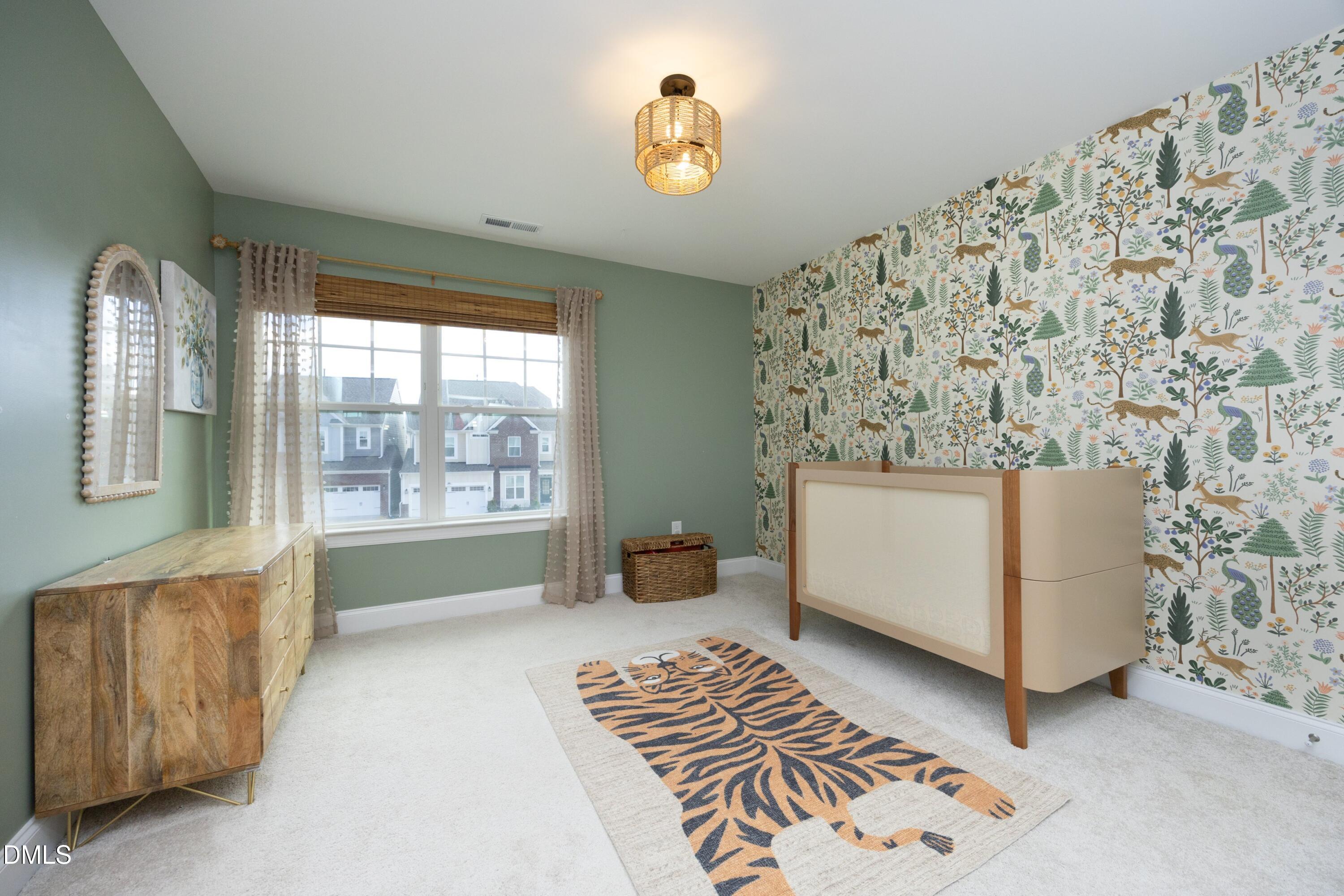 500 Ressler Street Holly Springs, NC 27540 - Photo 18 of 37 a living room with furniture and a window