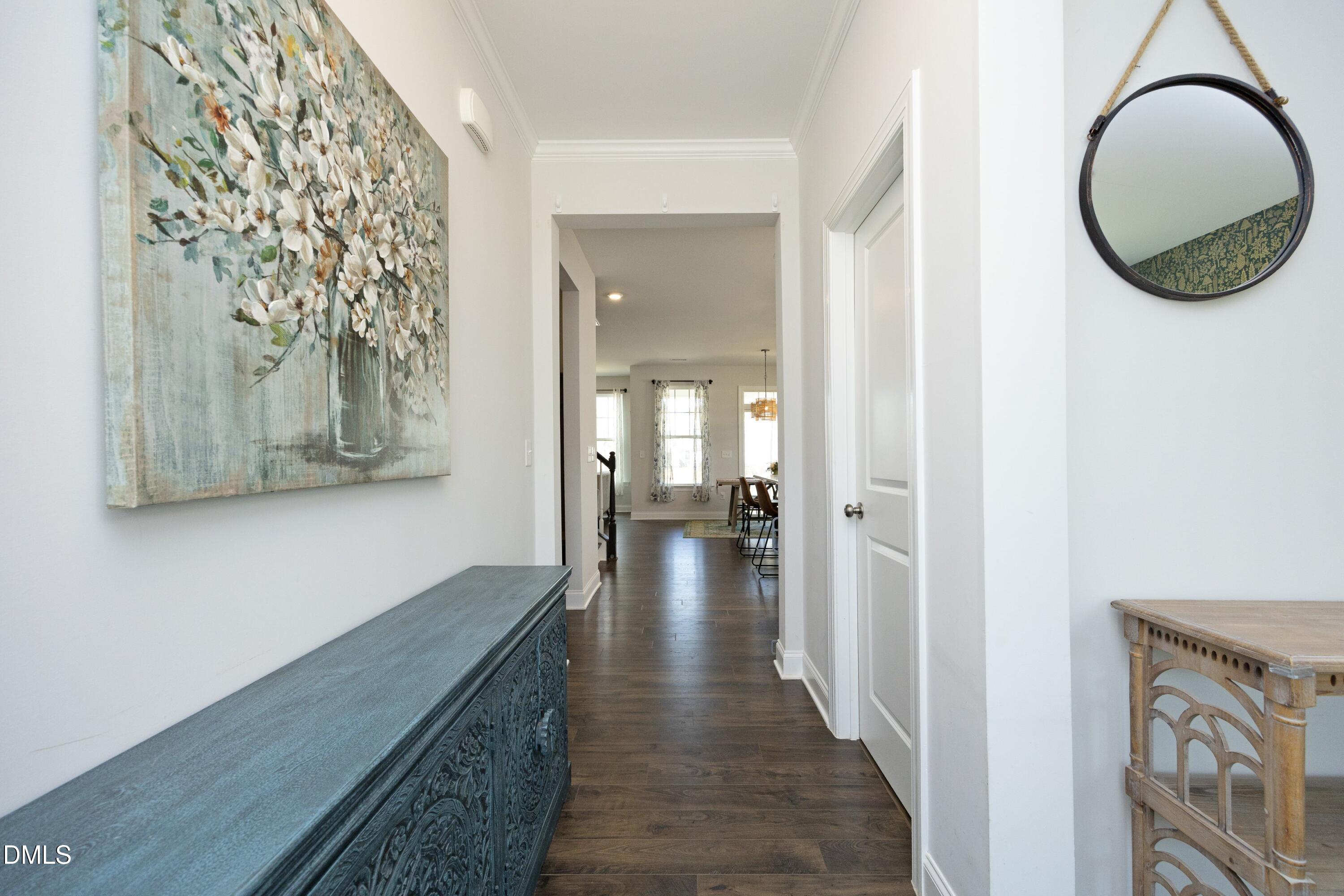 500 Ressler Street Holly Springs, NC 27540 - Photo 23 of 37 a view of a hallway with wooden floor and workspace
