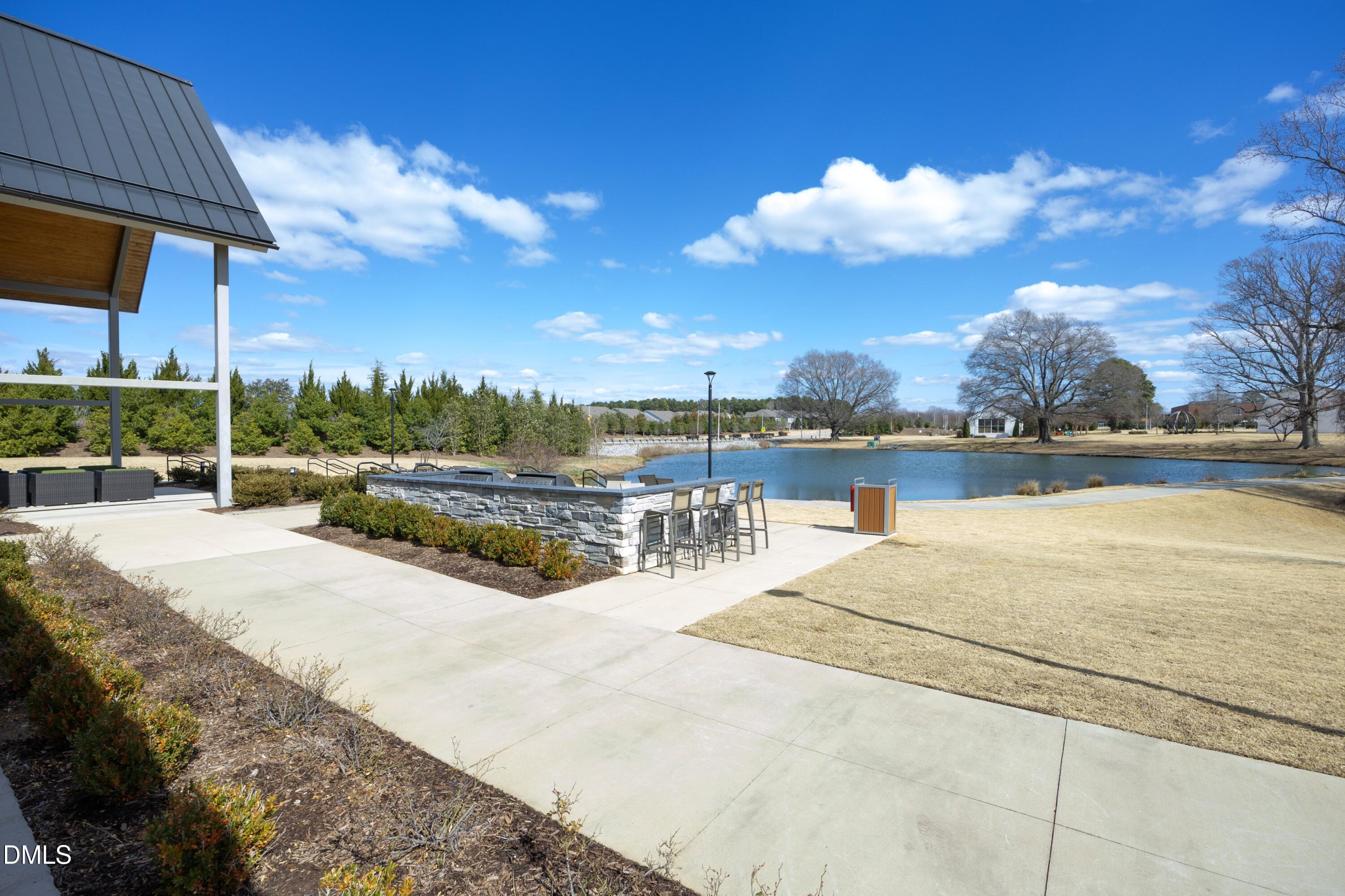 500 Ressler Street Holly Springs, NC 27540 - Photo 34 of 37 a view of swimming pool with outdoor seating and city view