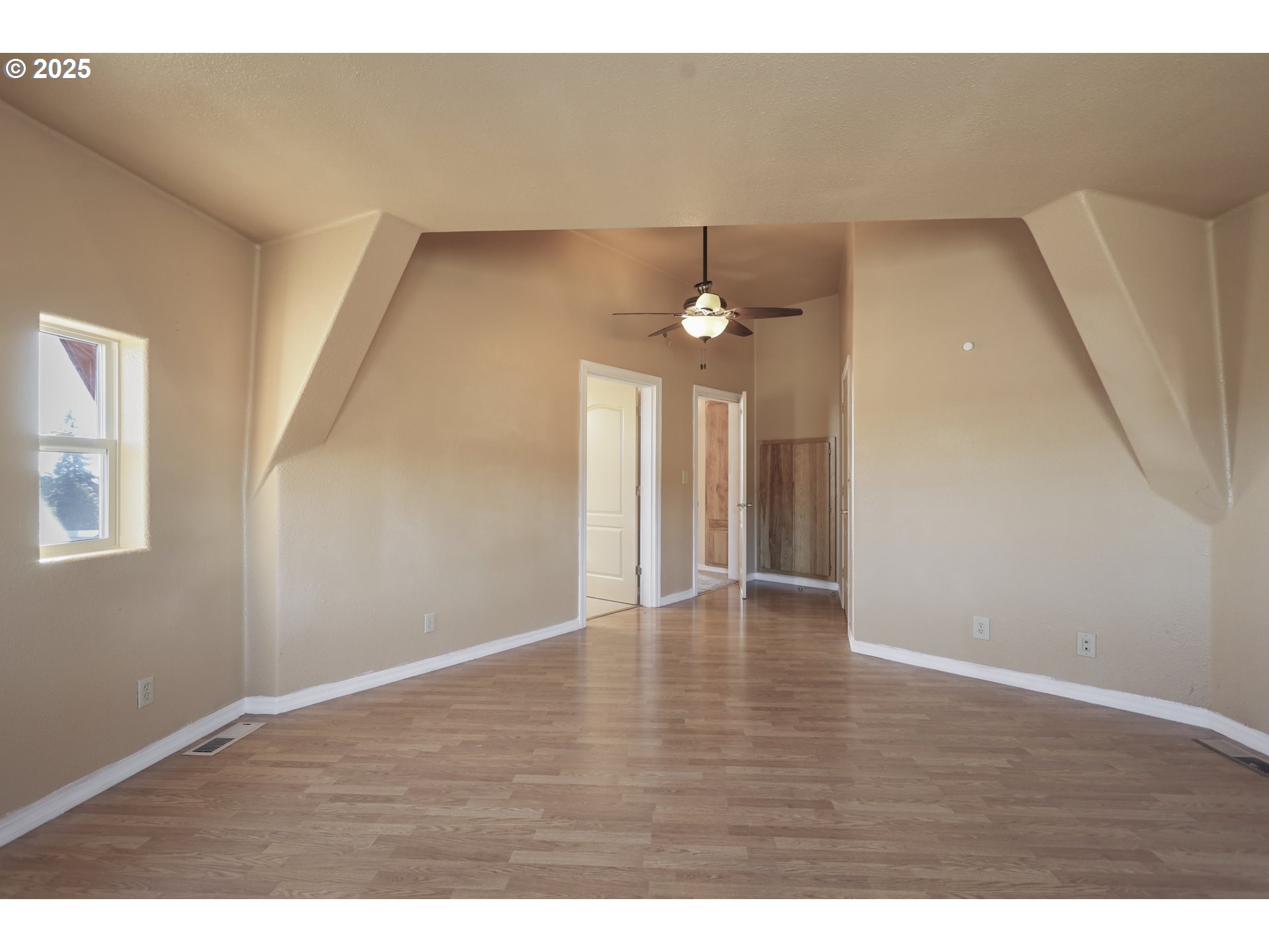 401 Johnson Road Lyle, WA 98635 - Photo 15 of 48 a view of an empty room with wooden floor