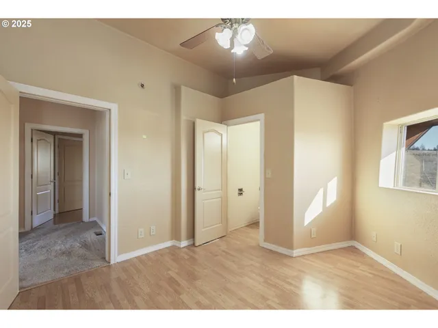 a view of an empty room and window