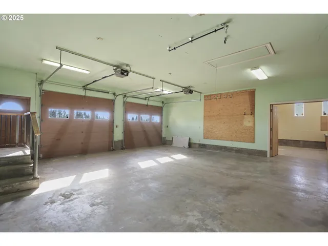 a view of a hallway with stairs