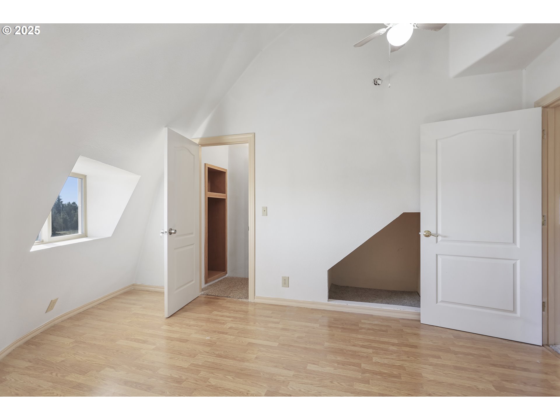 401 Johnson Road Lyle, WA 98635 - Photo 34 of 48 a view of an empty room with wooden floor and closet