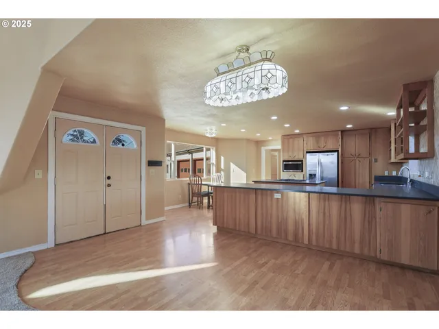 a view of a kitchen with a refrigerator