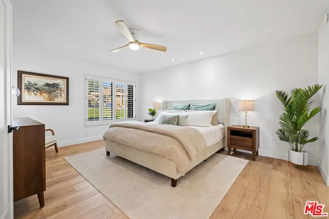 a bedroom with a large bed and a couch