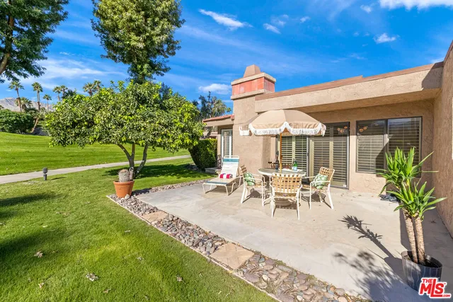 a view of swimming pool with outdoor seating