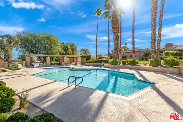 a view of a backyard with sitting area
