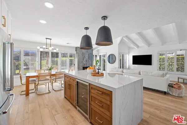 a kitchen with stainless steel appliances a sink and a large window