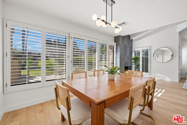 a view of a dining room with furniture window and outside view
