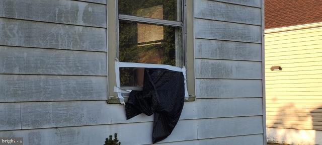 217 South Woodwell Road Dundalk, MD 21222 - Photo 11 of 49 a bathroom with a glass shower door