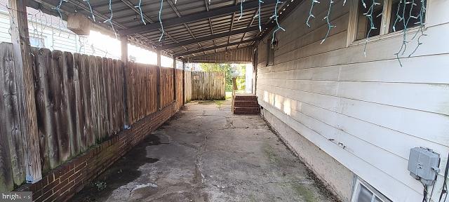 217 South Woodwell Road Dundalk, MD 21222 - Photo 14 of 49 a view of backyard with wooden fence