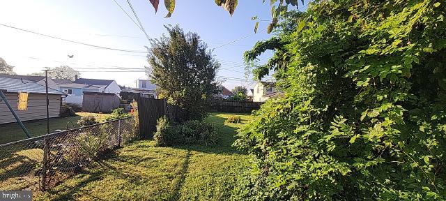 217 South Woodwell Road Dundalk, MD 21222 - Photo 17 of 49 a view of a house with a yard