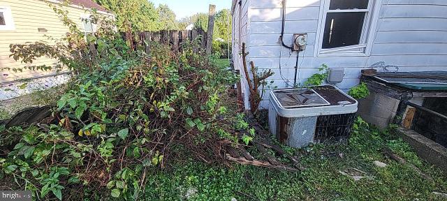 217 South Woodwell Road Dundalk, MD 21222 - Photo 19 of 49 a view of a house with a chairs and table in a patio
