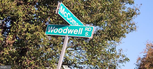 217 South Woodwell Road Dundalk, MD 21222 - Photo 2 of 49 a street sign that is on a pole