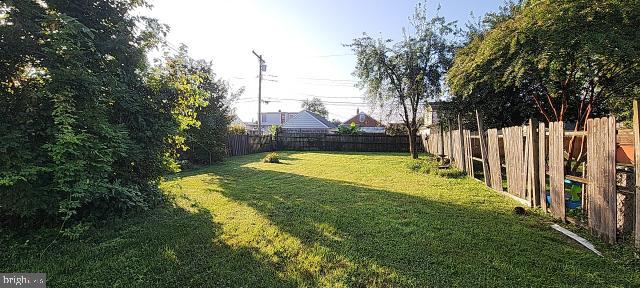 217 South Woodwell Road Dundalk, MD 21222 - Photo 21 of 49 a view of a swimming pool with a garden