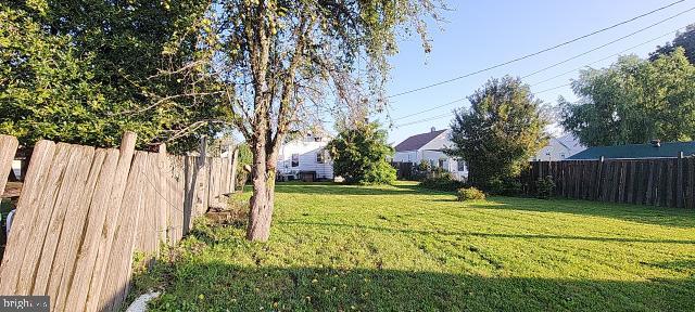 217 South Woodwell Road Dundalk, MD 21222 - Photo 24 of 49 a view of a backyard with wooden fence