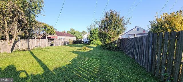217 South Woodwell Road Dundalk, MD 21222 - Photo 25 of 49 a view of yard with swimming pool and trees in the background