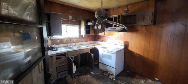 217 South Woodwell Road Dundalk, MD 21222 - Photo 27 of 49 a kitchen with a sink a washer and dryer