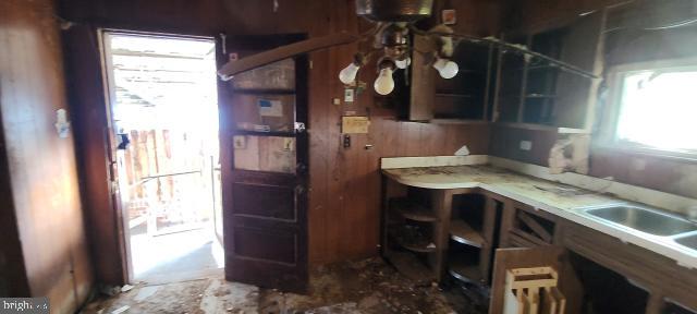 217 South Woodwell Road Dundalk, MD 21222 - Photo 29 of 49 a bathroom with a sink a vanity and a large mirror