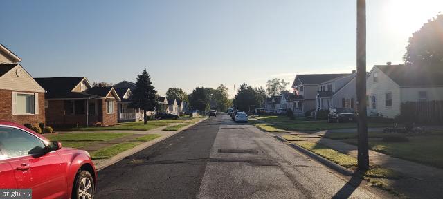 217 South Woodwell Road Dundalk, MD 21222 - Photo 4 of 49 a view of a street with cars on both side of road