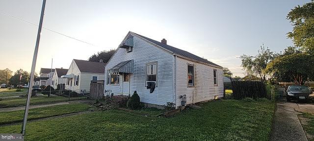217 South Woodwell Road Dundalk, MD 21222 - Photo 6 of 49 a view of a white house next to a yard