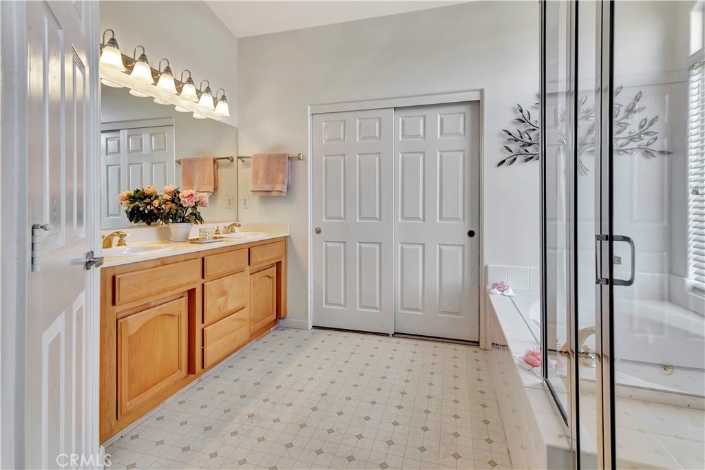 2104 Summit Drive Paso Robles, CA 93446 - Photo 25 of 31 a bathroom with a sink a mirror and a shower