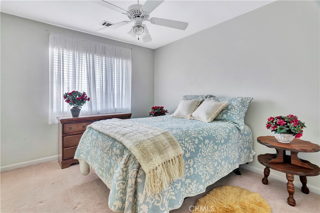 2104 Summit Drive Paso Robles, CA 93446 - Photo 27 of 31 a bedroom with a bed and a chandelier