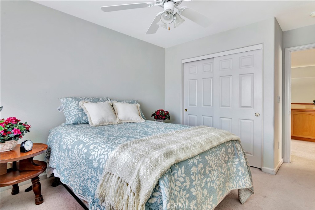 2104 Summit Drive Paso Robles, CA 93446 - Photo 28 of 31 a bedroom with a bed and a chandelier