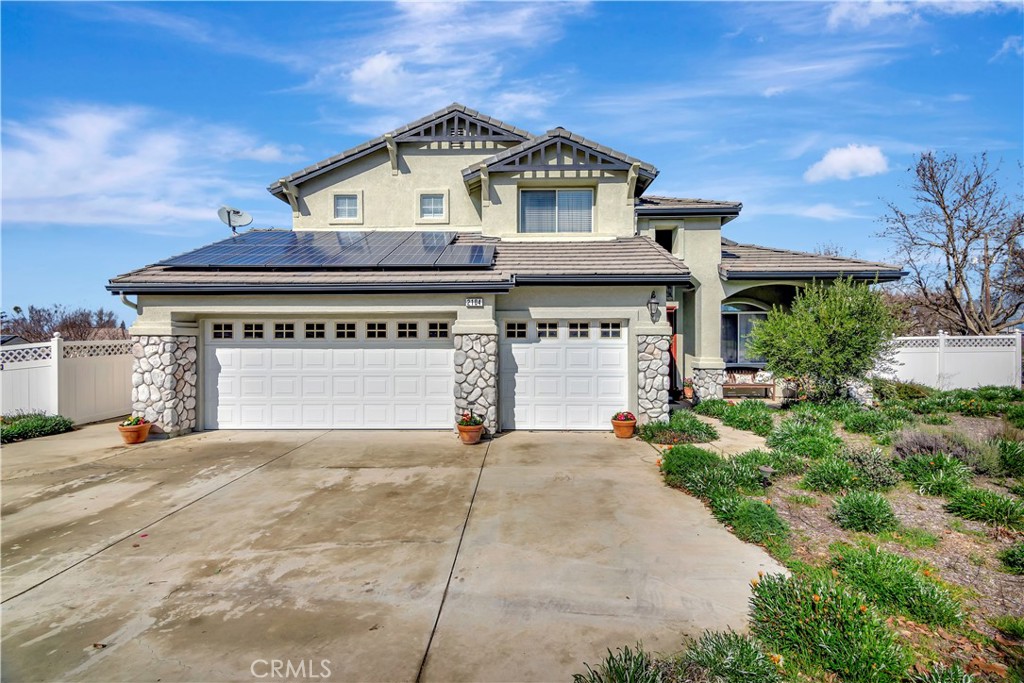 2104 Summit Drive Paso Robles, CA 93446 - Photo 3 of 31 a front view of a house with a yard and garage