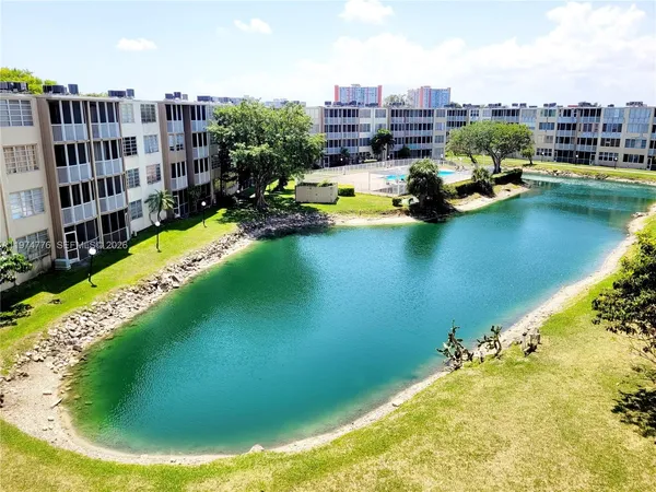 a view of a swimming pool with a table and chairs