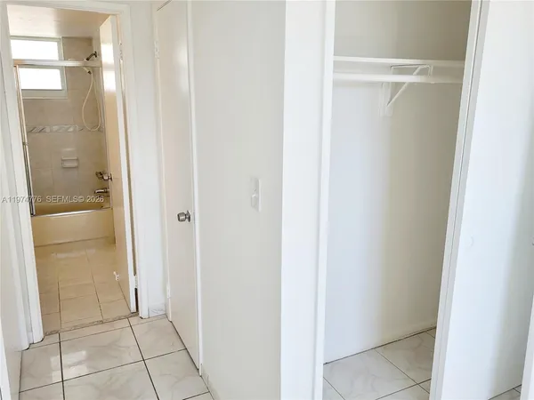 a view of a bathroom with a glass door
