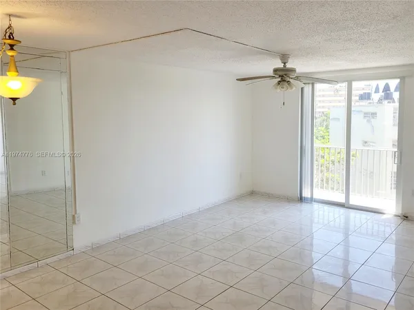 a view of an empty room and a window