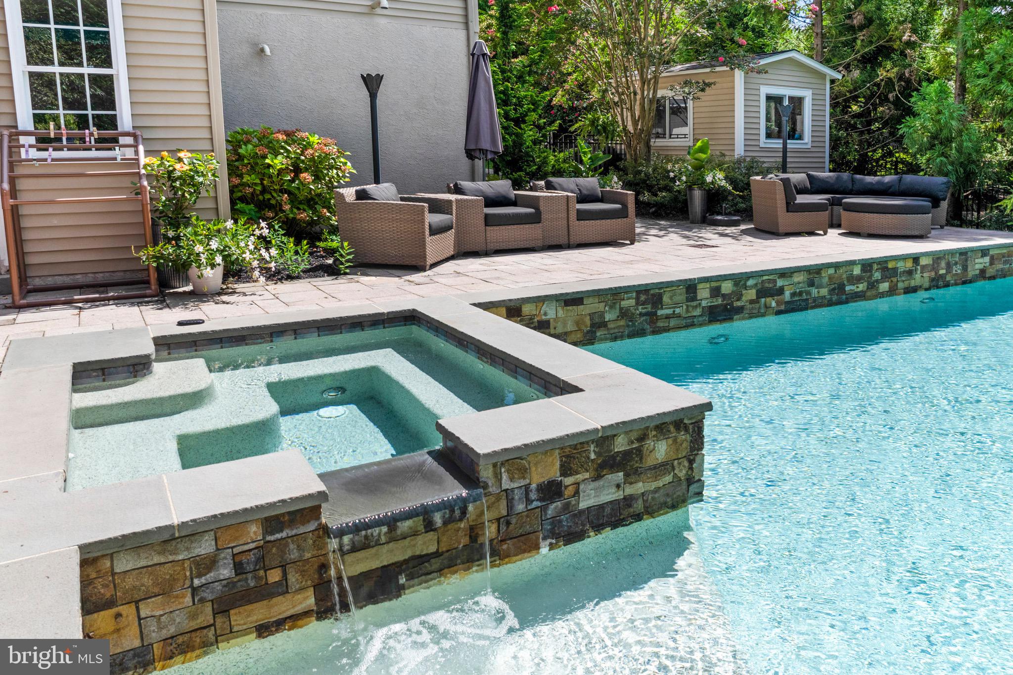 23 Regal's Court Swedesboro, NJ 08085 - Photo 17 of 74 a view of a house with backyard sitting area and swimming pool